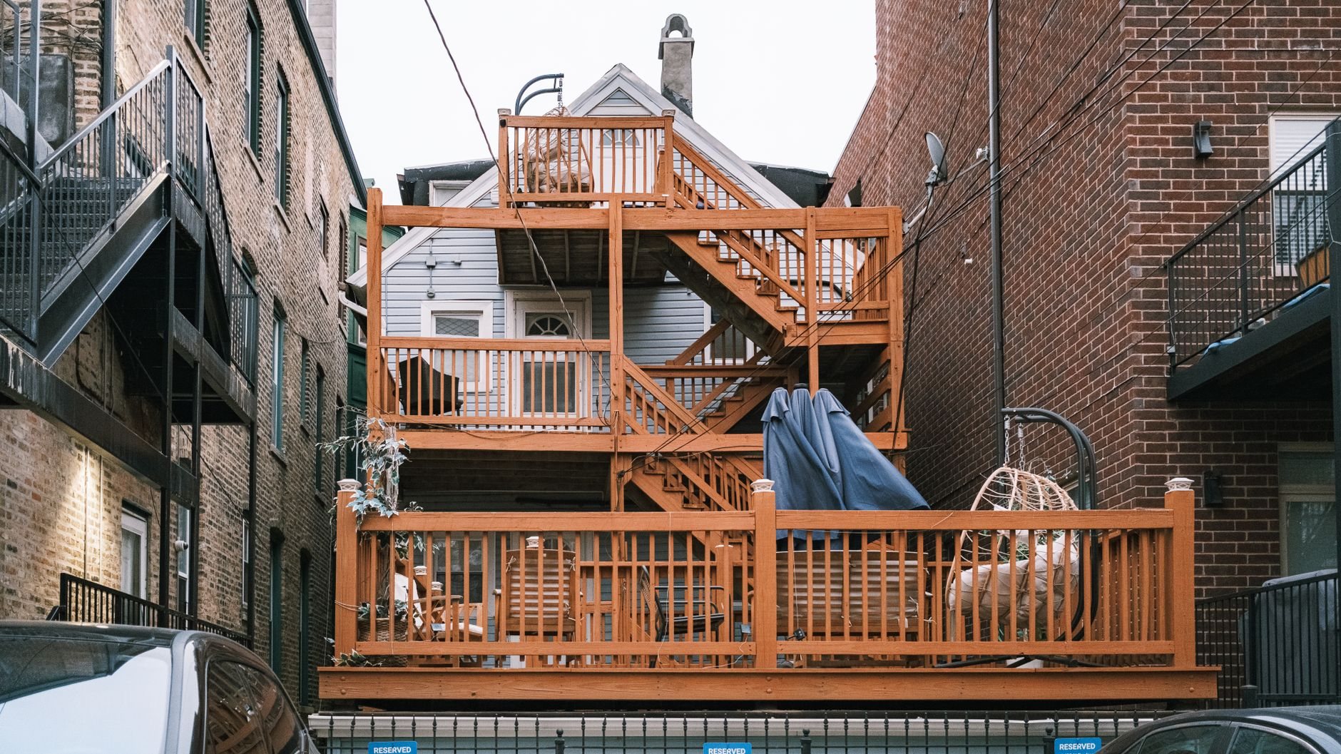 Backyard deck under construction with joists and framing exposed