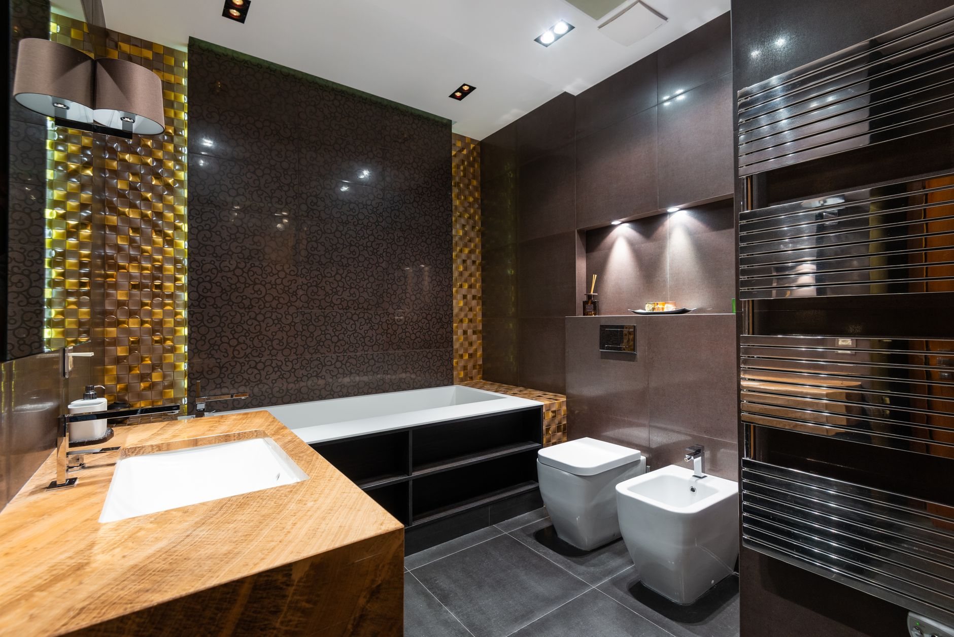 Bathroom with newly installed modern faucet, lighting, and hardware