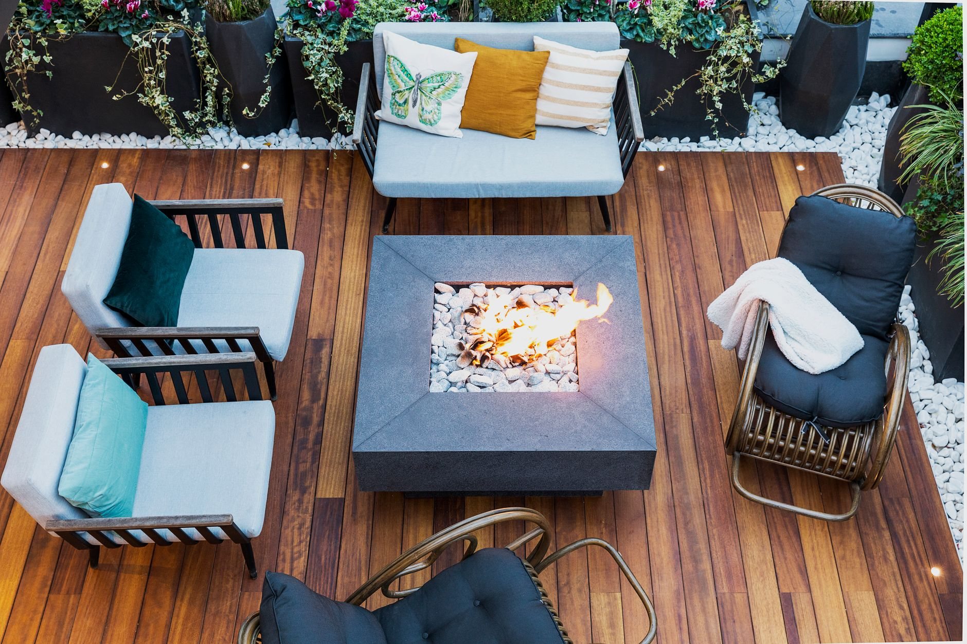 Patio with a central masonry fire pit surrounded by outdoor seating
