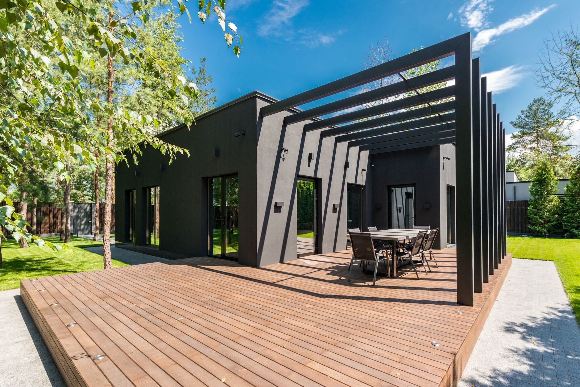 New wooden deck and outdoor dining area of the kind built on Vineyard's bare new-development lots