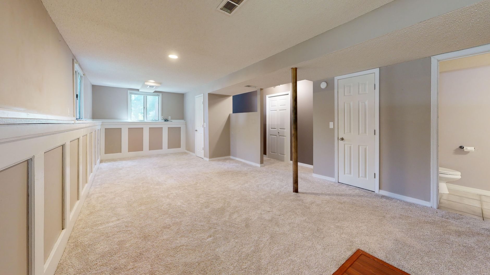 Finished basement bright and clean modern basement with carpet flooring and recessed lighting