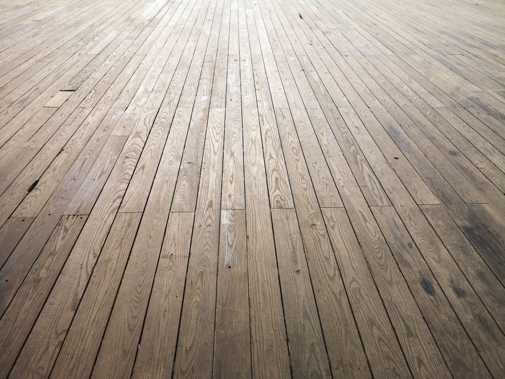 Close view of hardwood floor planks showing grain and texture after installation