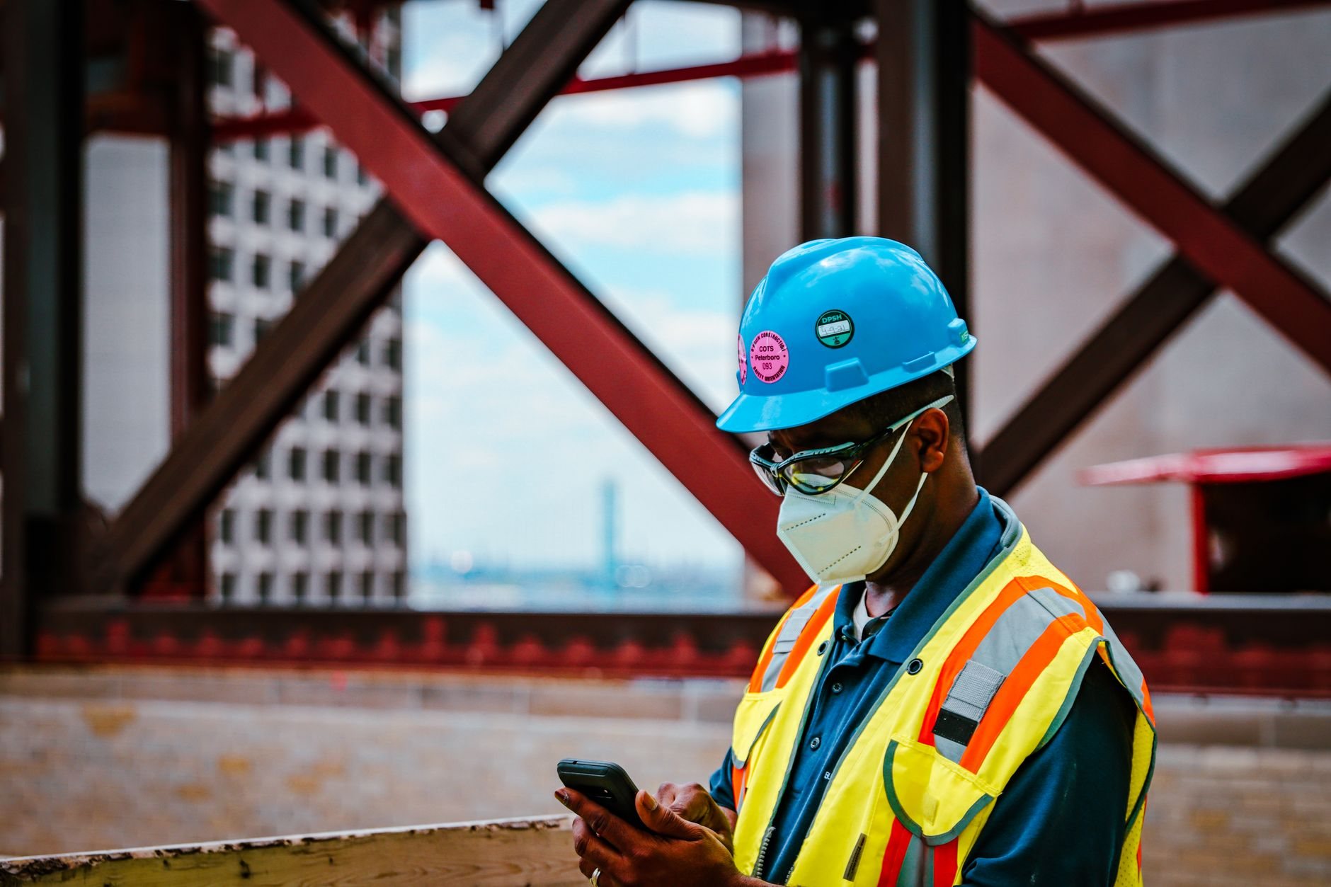 Contractor taking a phone call on an active jobsite