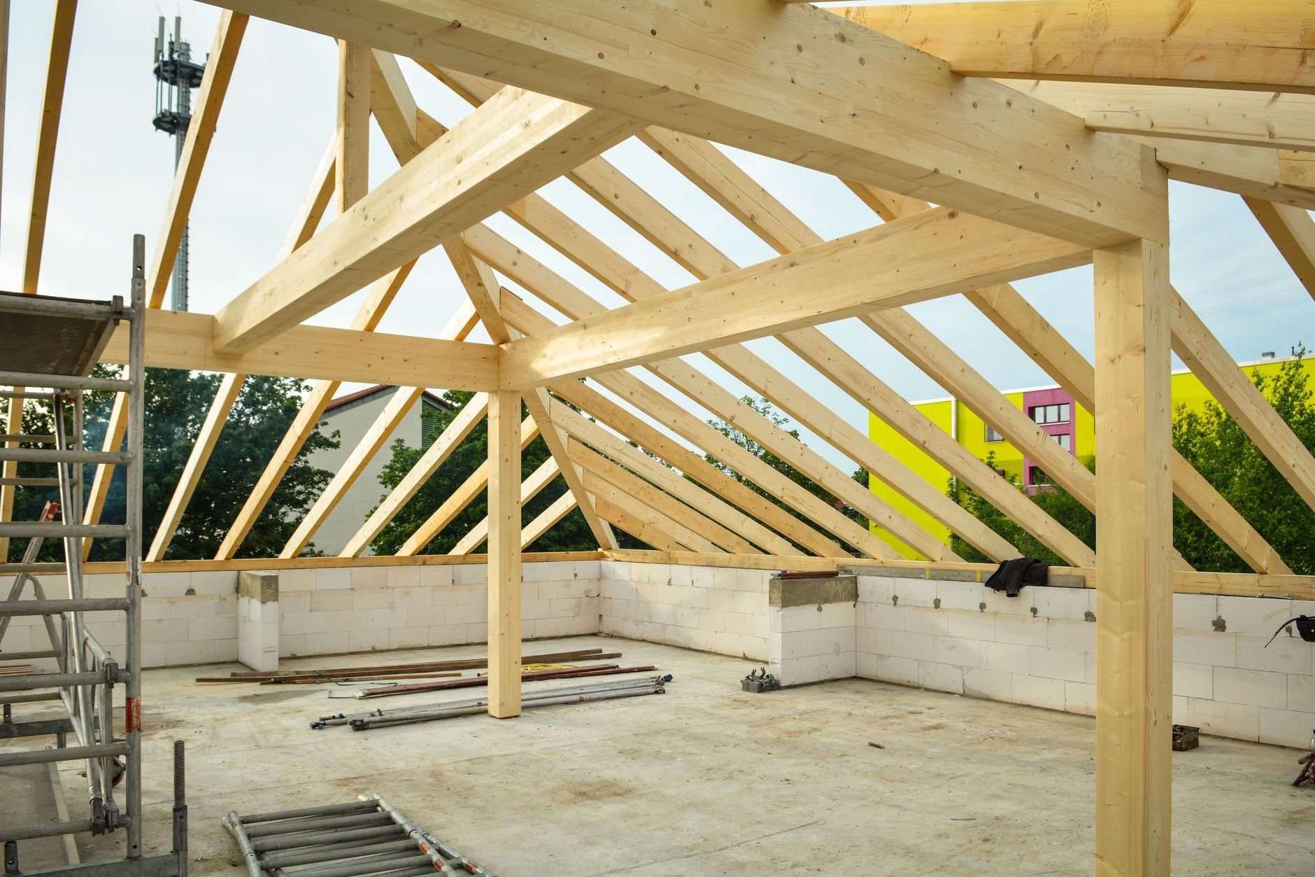 Room addition framed against an existing home