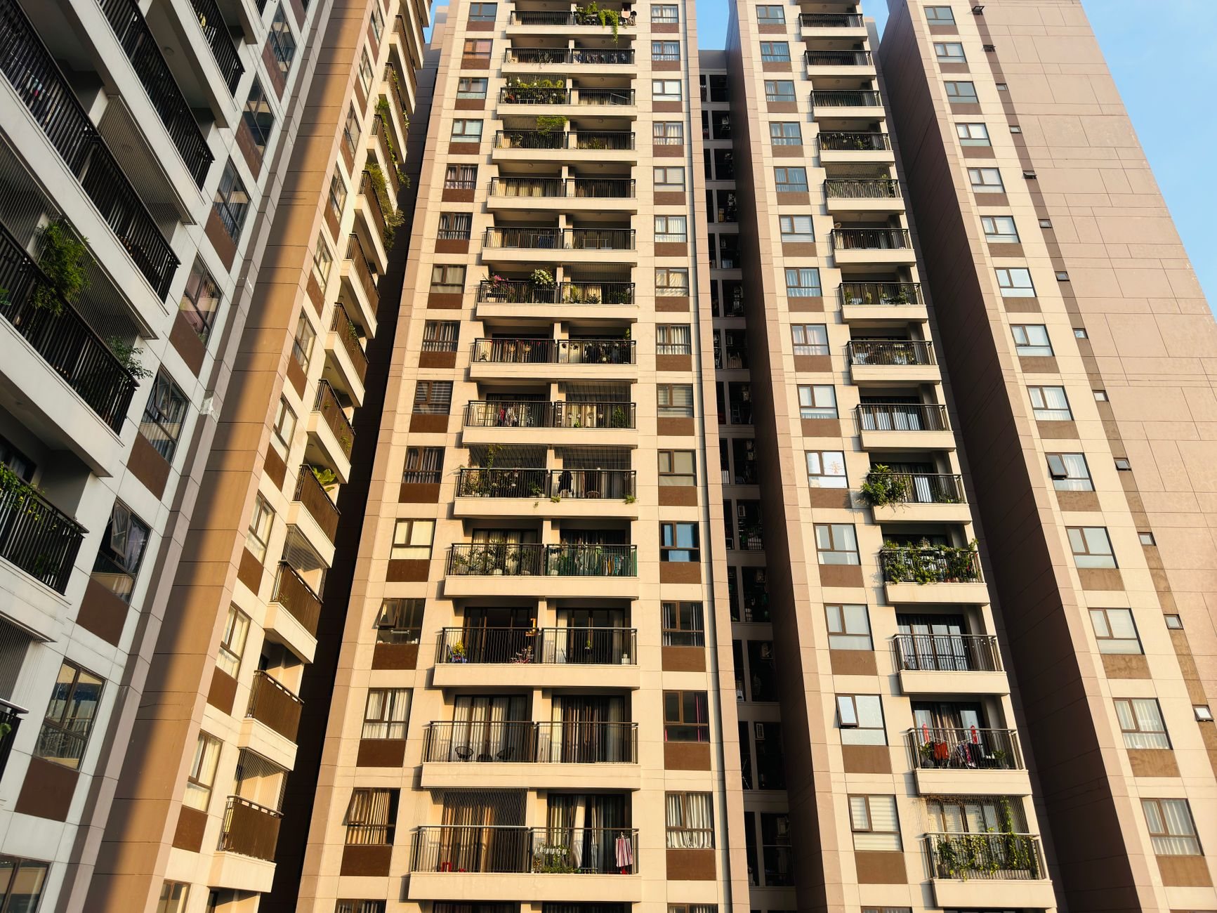 Multi-story condominium building with private balconies in an urban Salt Lake setting