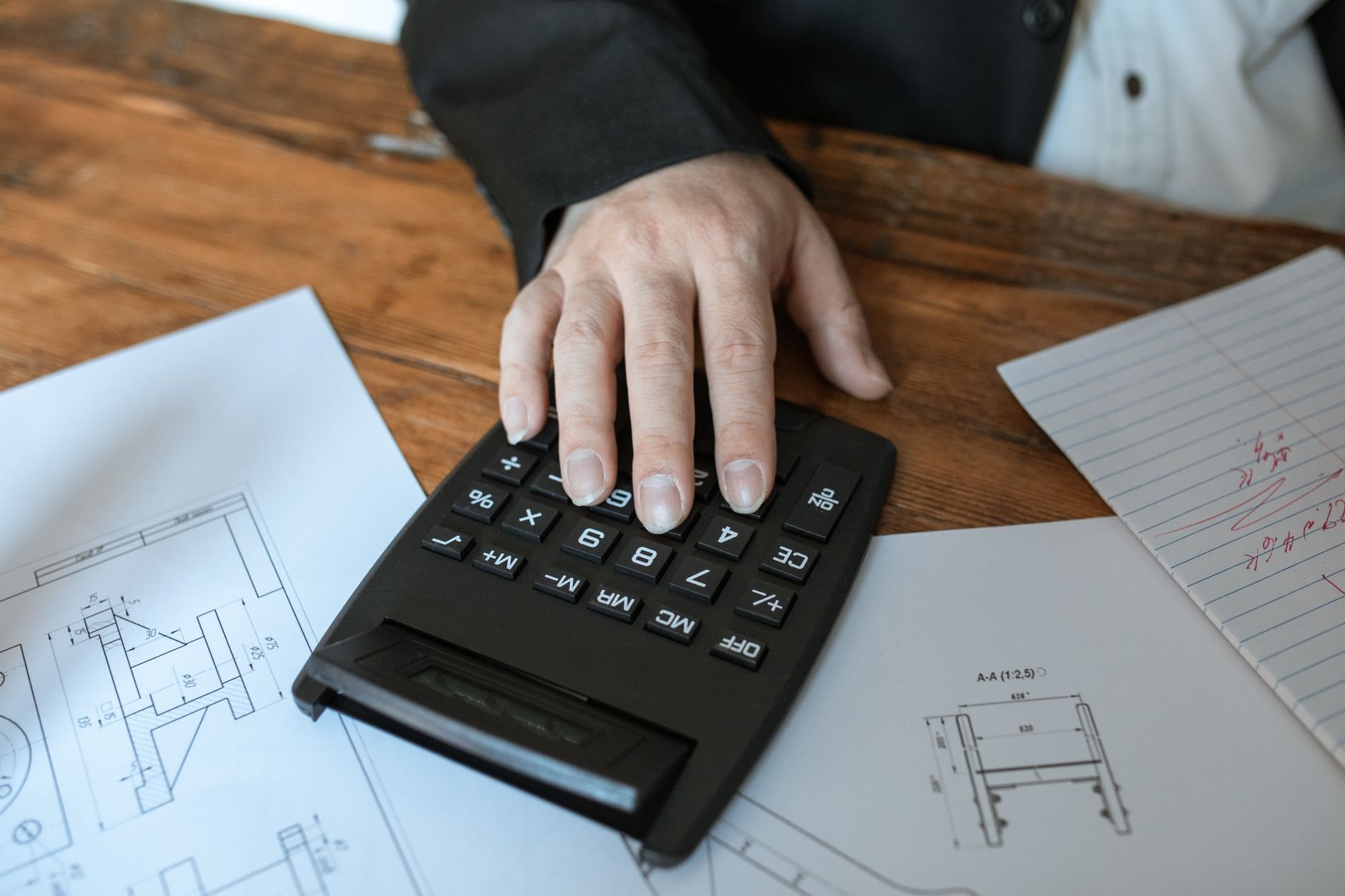 Working through a construction cost estimate over drawings