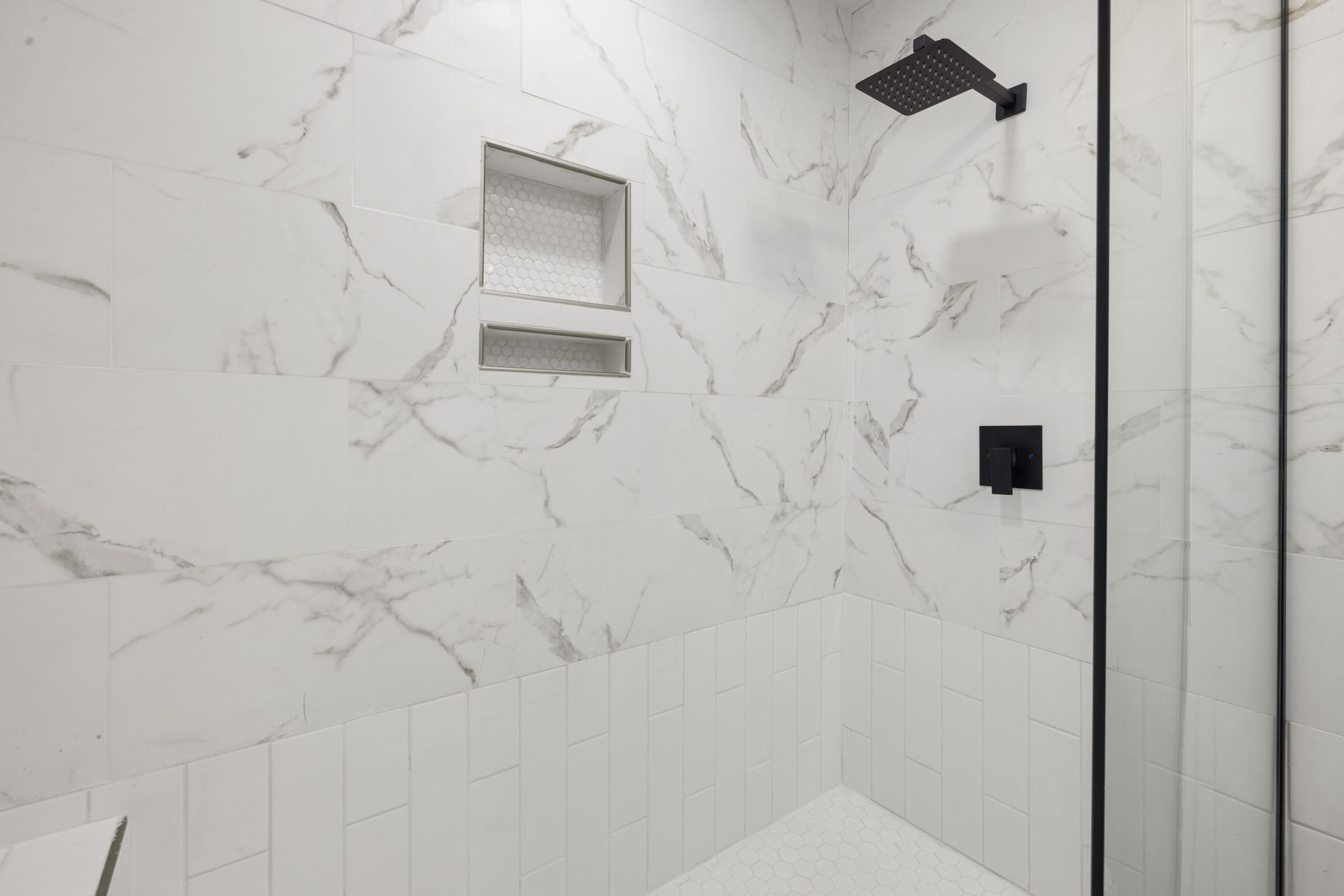 Remodeled bathroom with tiled walk-in shower