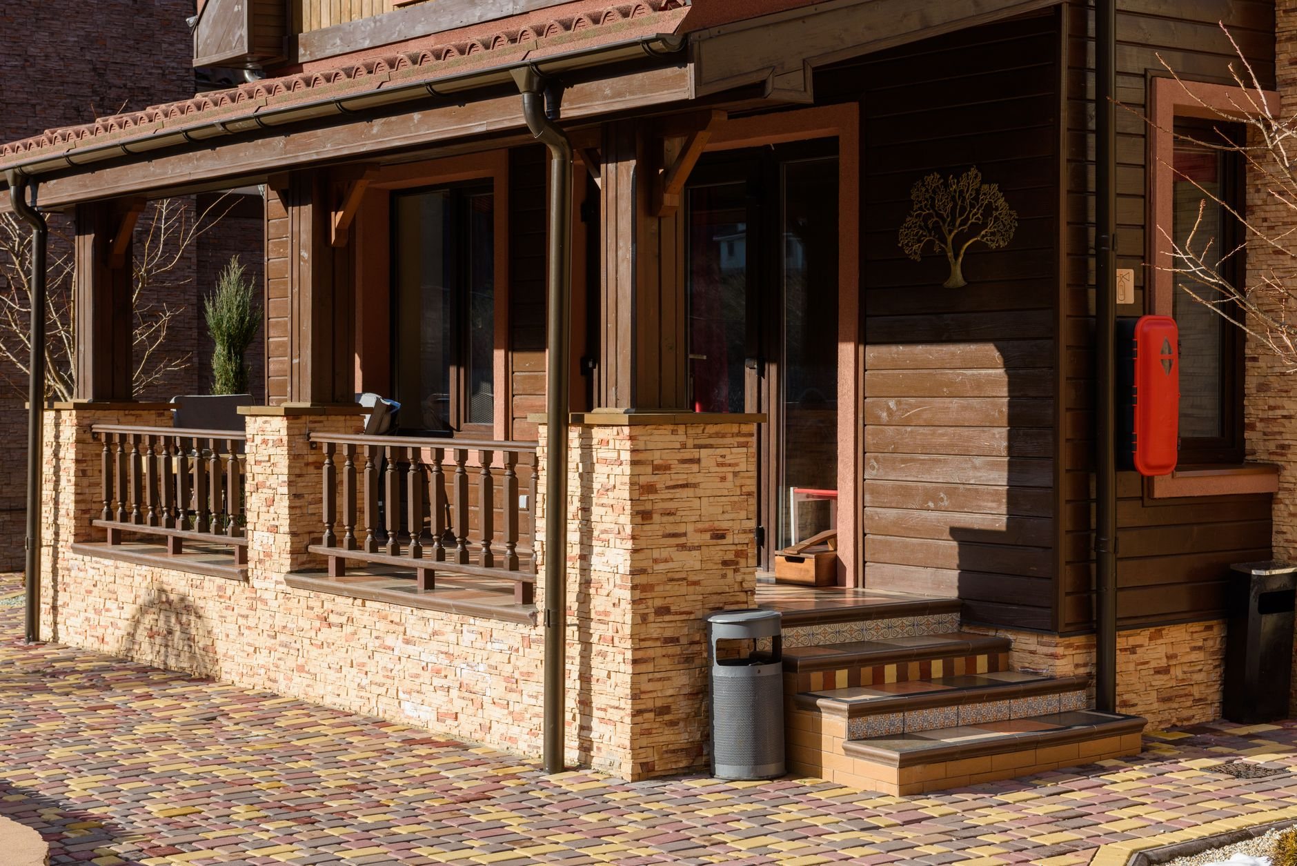 Finished wood-look siding with stone accents on a Utah home exterior