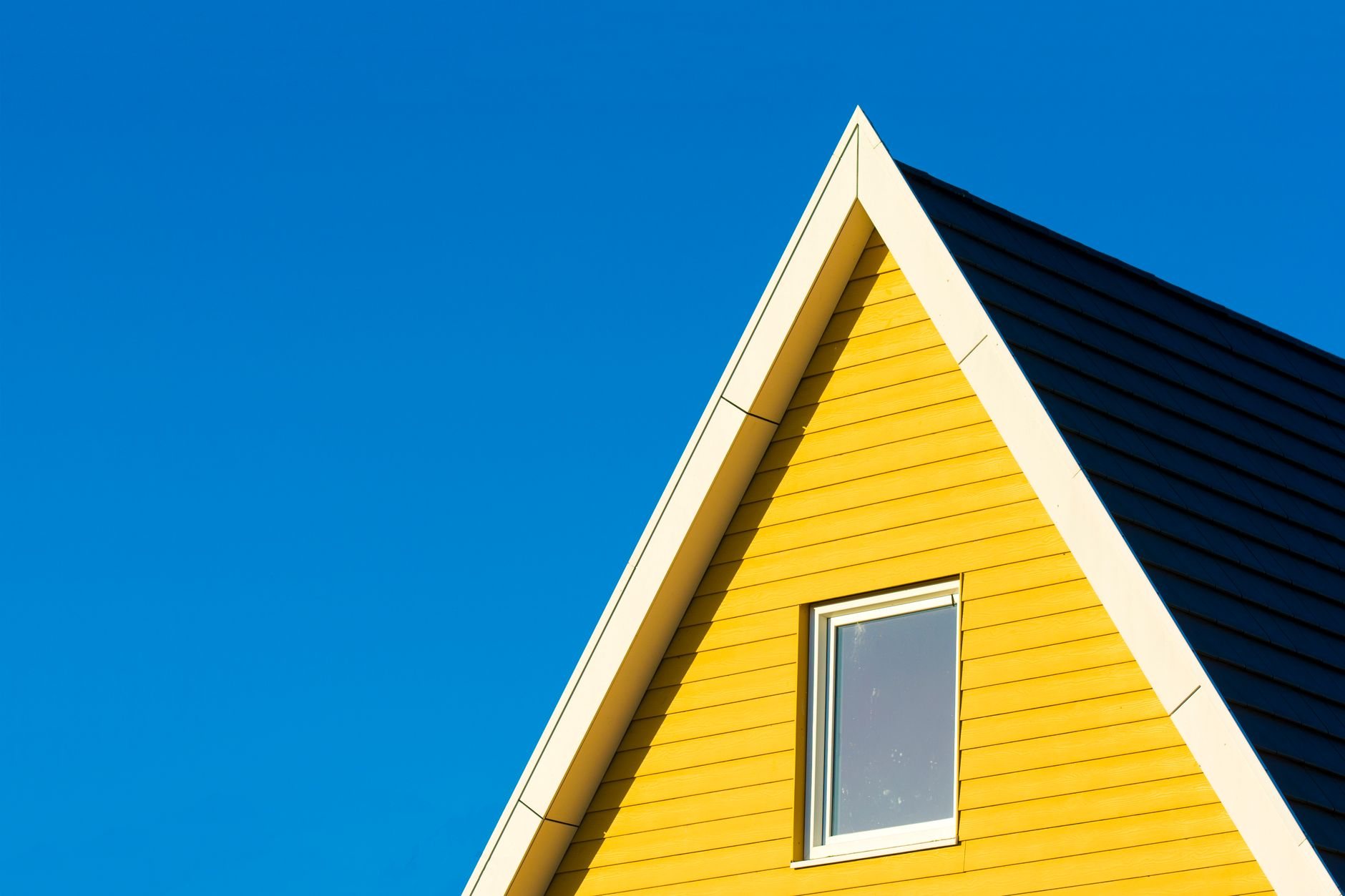 Close-up of finished lap siding and roofline trim on a Utah home