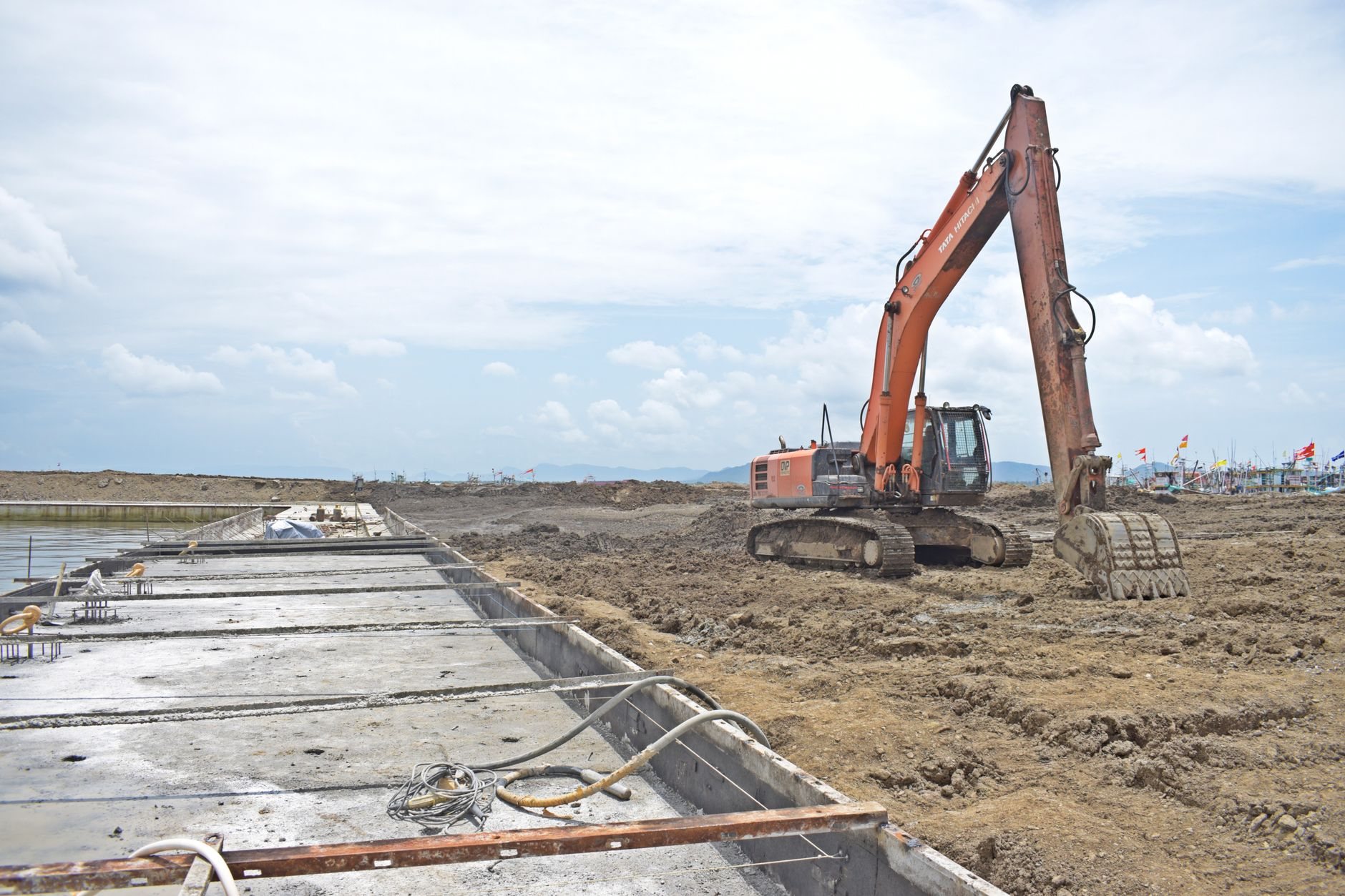Excavator preparing a building pad and foundation excavation
