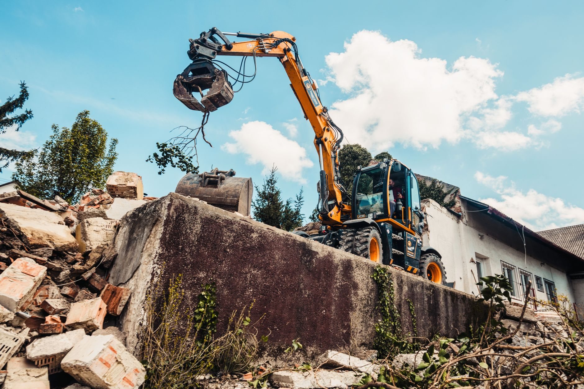 Excavator demolishing a structure