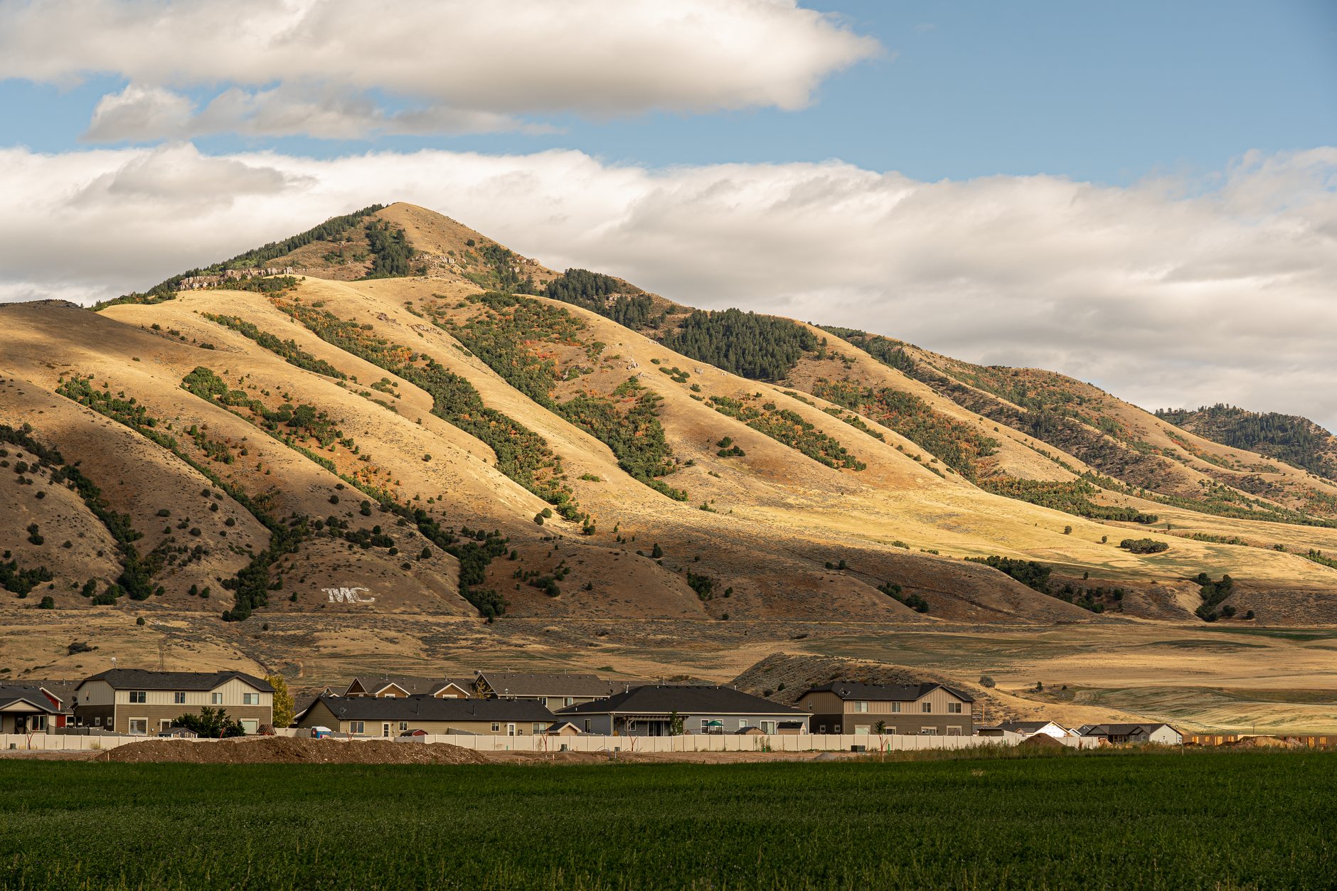 Aerial view of a Utah neighborhood against the mountains