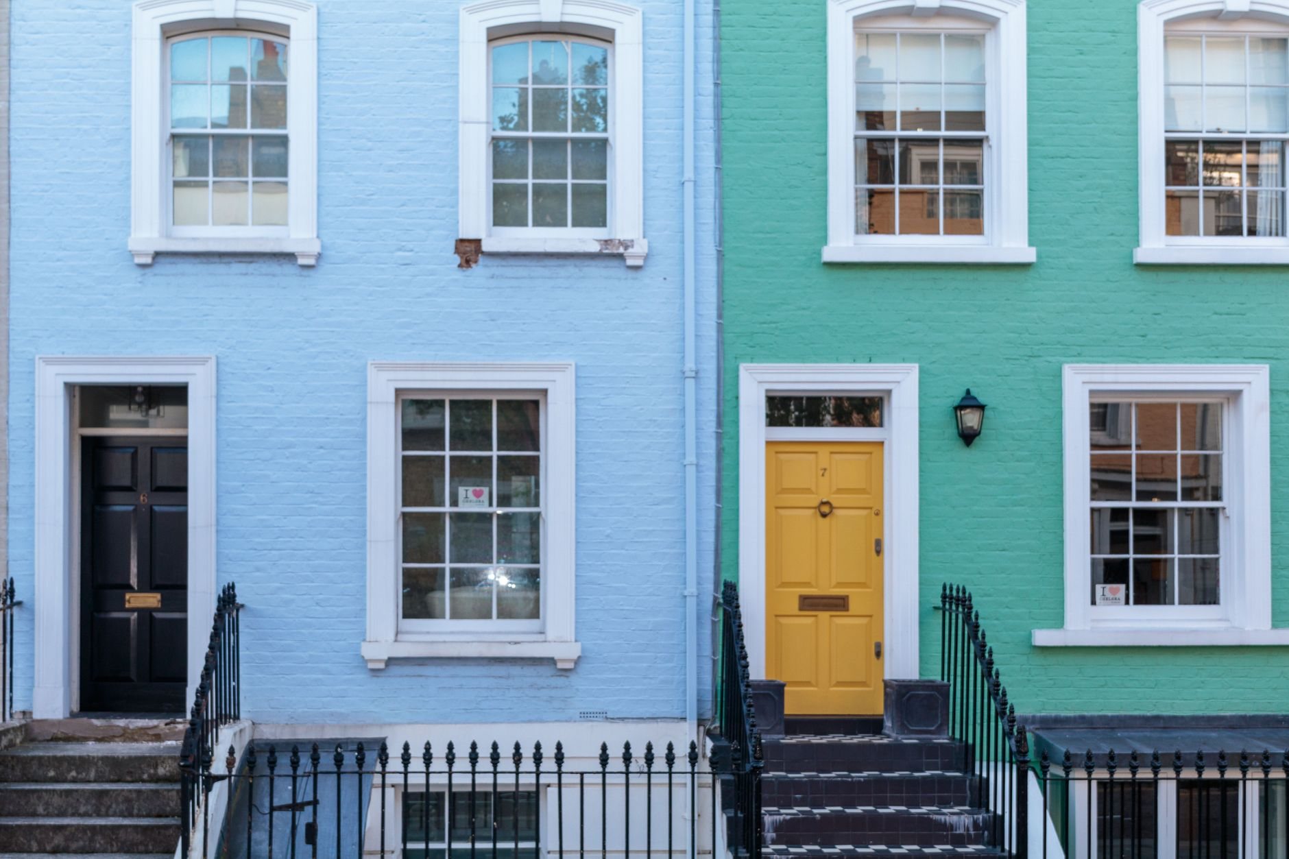 Restored brick row-house facades with original window and door openings